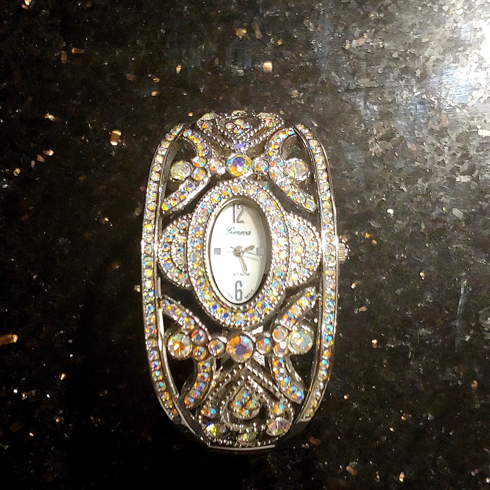 Silver cuff watch featuring Swarovski crystals.